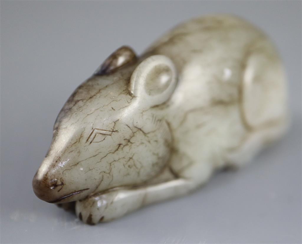 A Chinese grey and black jade figure of a recumbent mouse, 7.7cm long